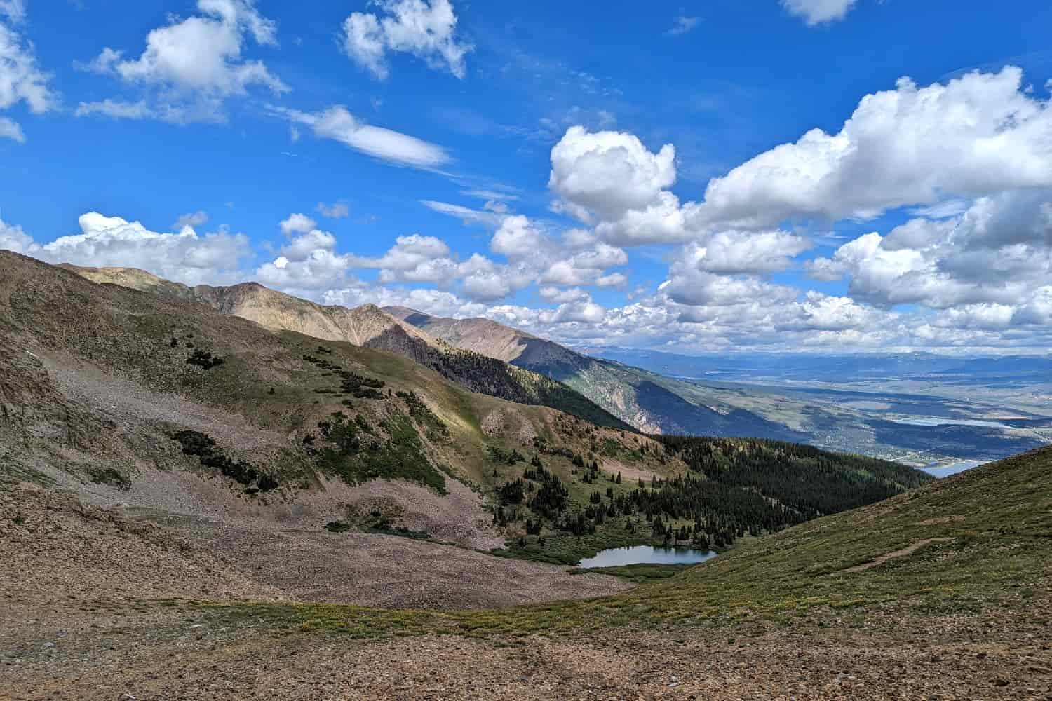 blue skies and white clouds over the collegiate peaks wilderness loop