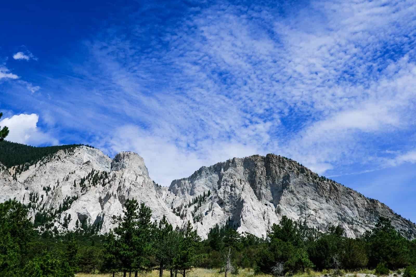 valley view of a white and gray exposed rocky butte.