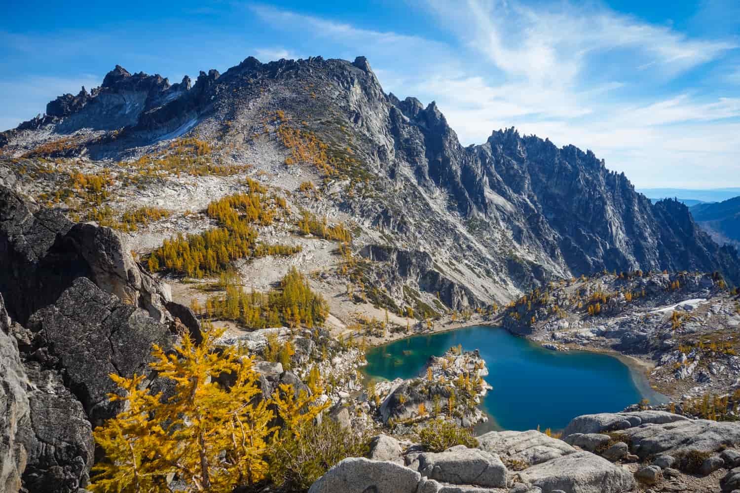 alpine lakes wilderness with granite mountain and blue alpine lake on a sunny day