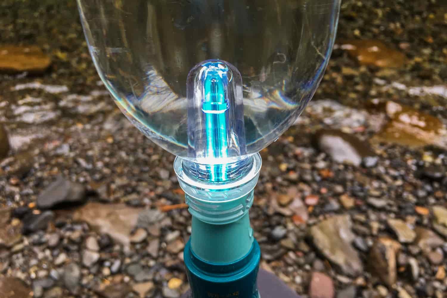 the uv light glowing inside a waterbottle 