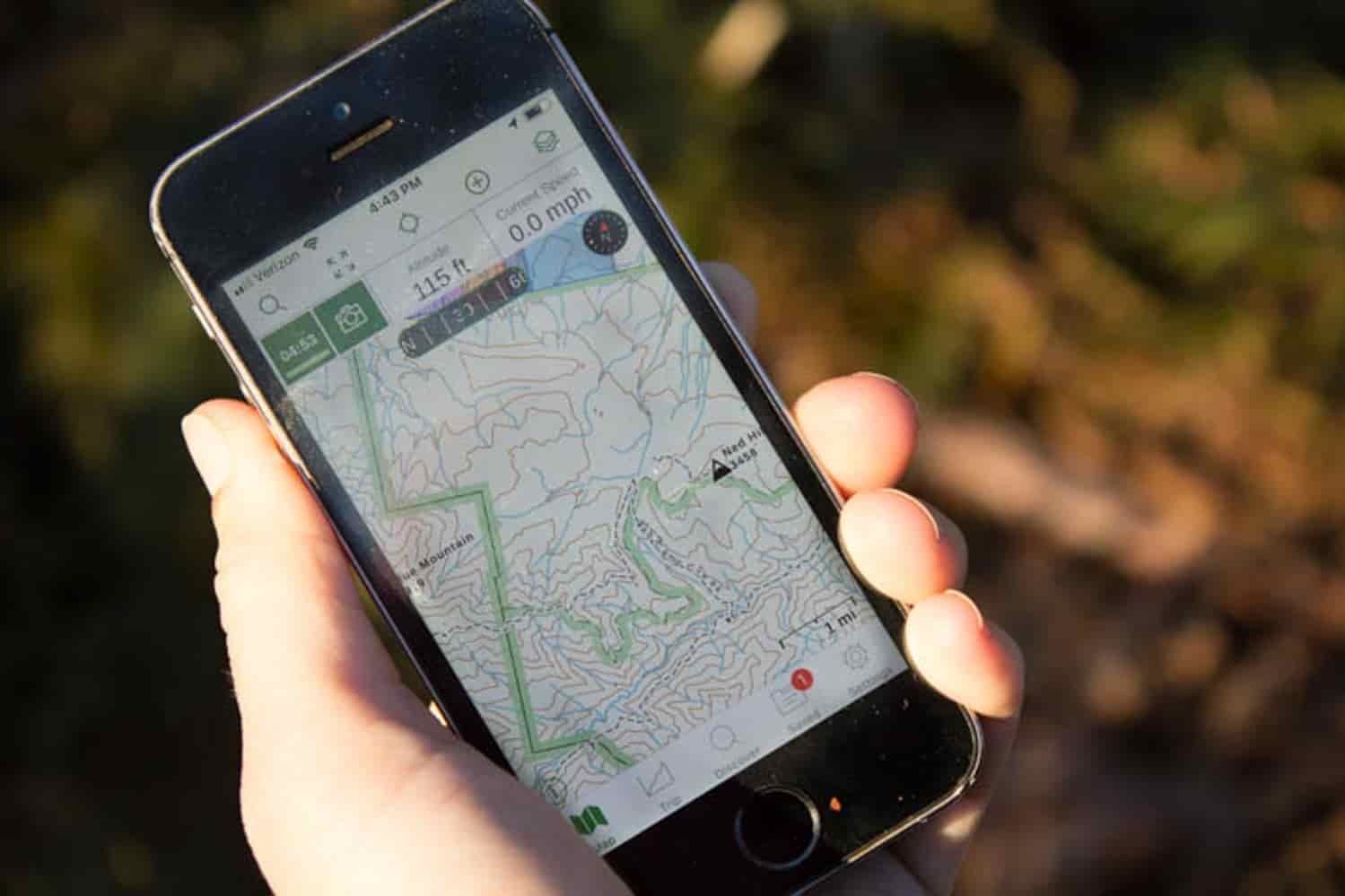 hand holding a phone with a map on it