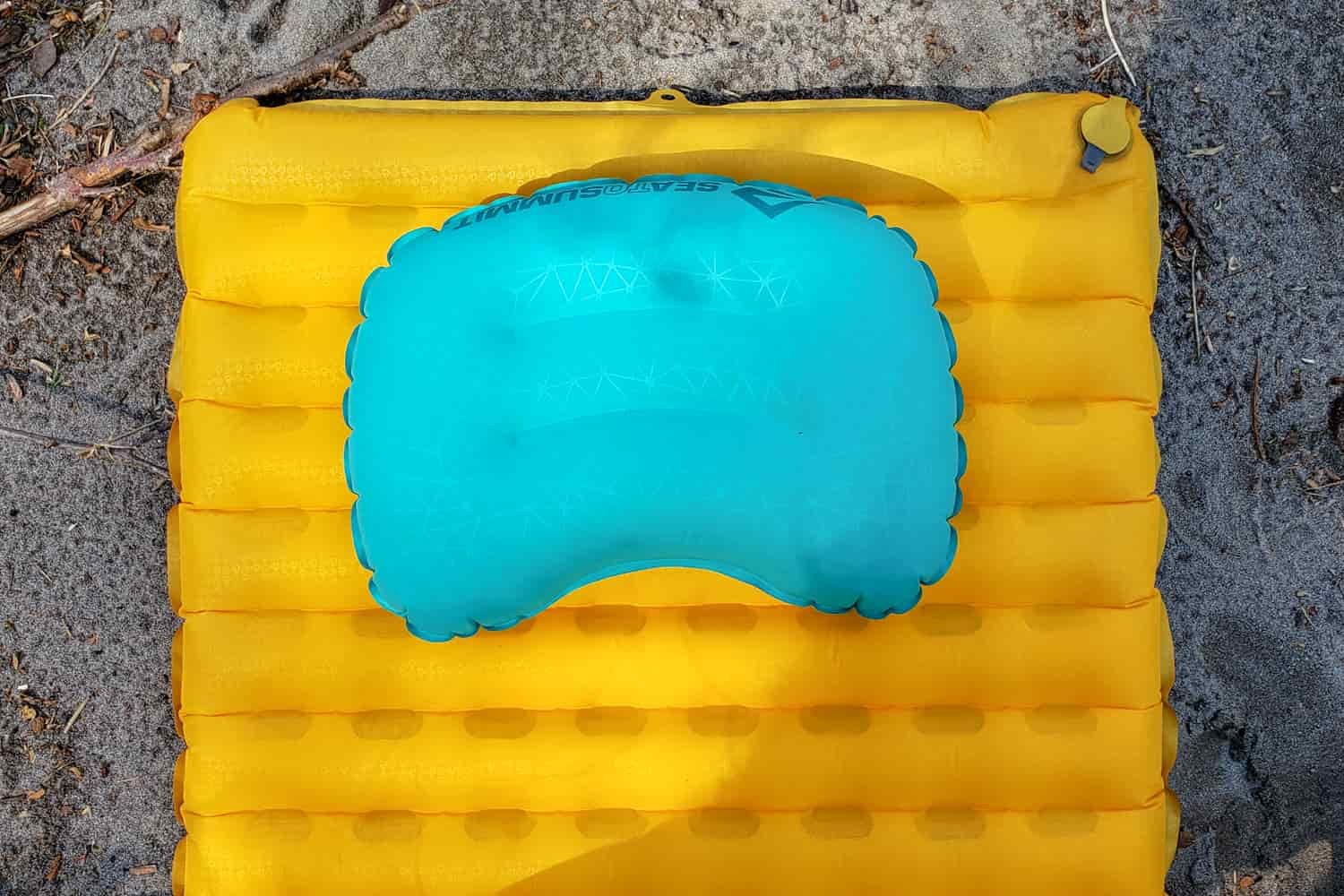 A NEMO tensor trail ultralight sleeping pad and an inflated backpacking pillow on top.