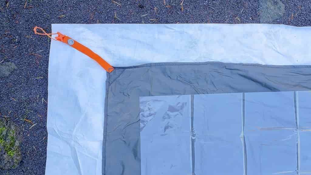 3 types of ground sheets laid on top of each other: Tyvek, a manufacturer's footprint, and polycryo