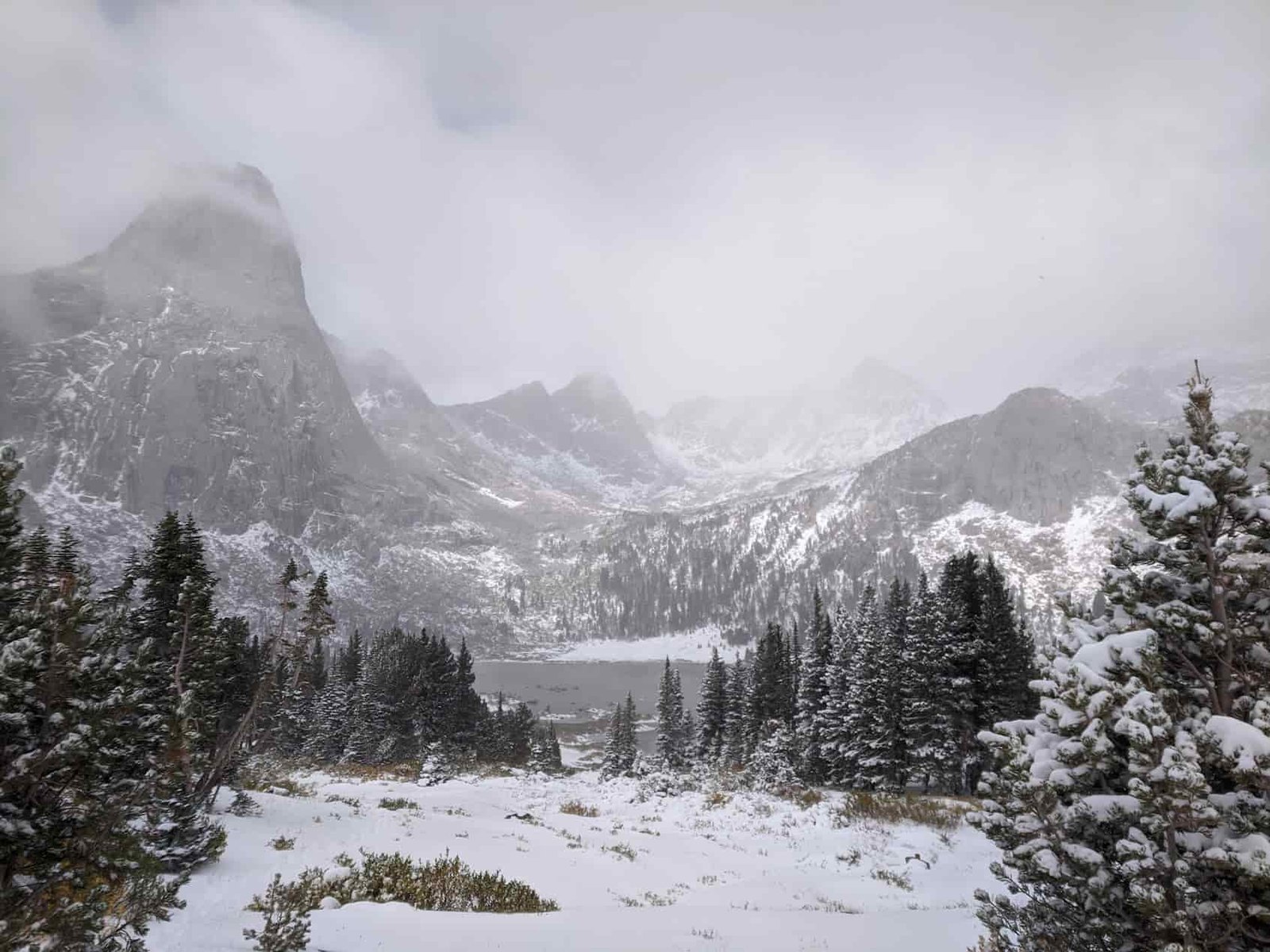 a stormy snowy mountain scene in the cirque of the towers in the wind river range