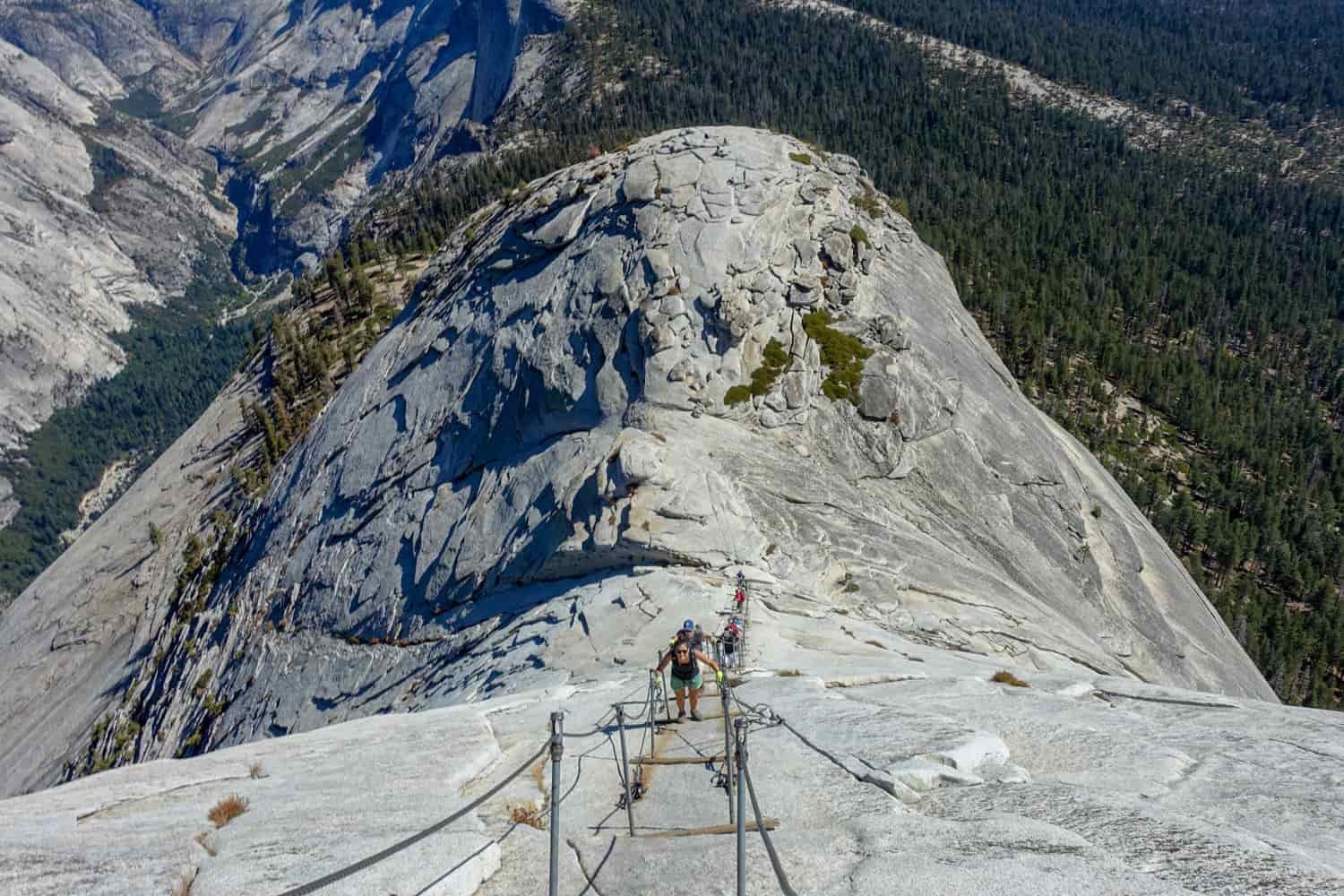hikers on the cable assisted section of the half dome hike
