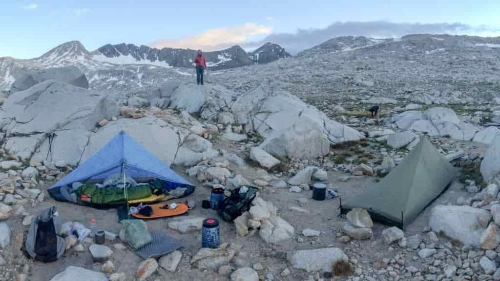 Two ultralight tents pitched on rocks at high elevation