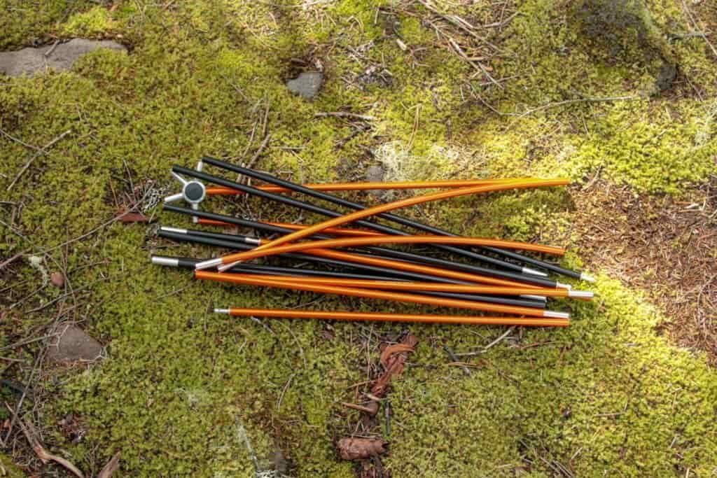 tent poles folded on moss