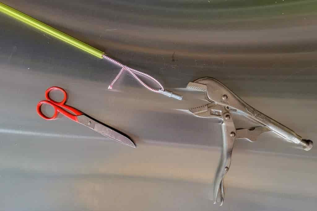 scissors, tent pole and pliers