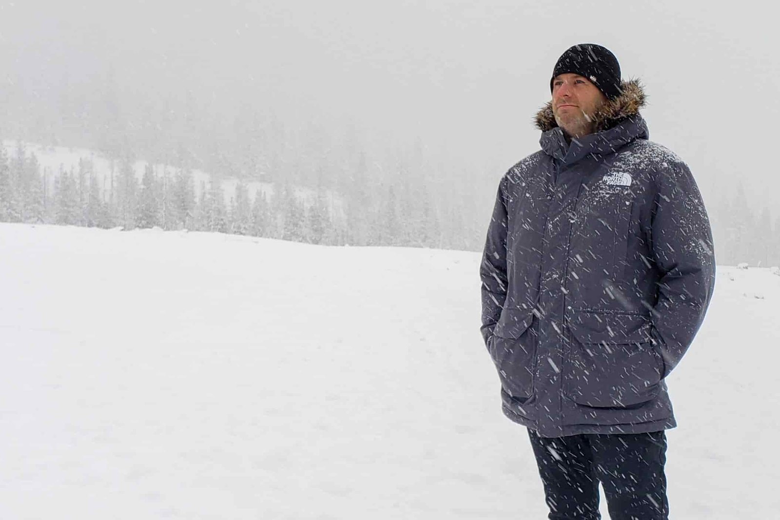 A-man-wearing-the-North-Face-McMurdo-Park-in-the-driving-snow