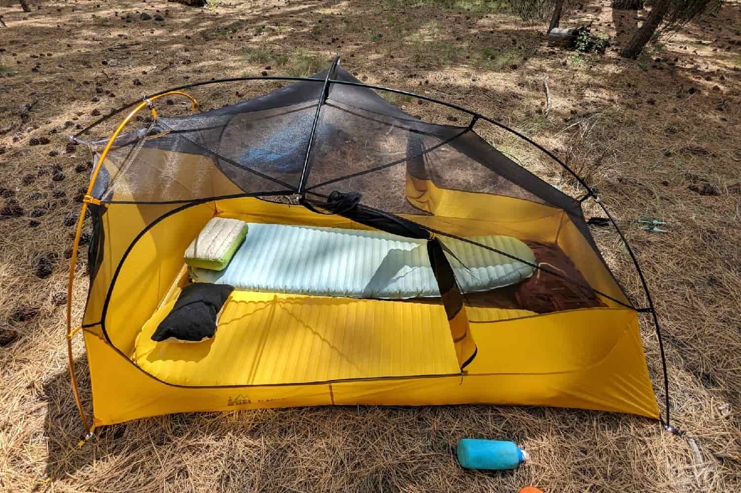 a tent set up with two sleeping pads and two camping pillows including the therm-a-rest neoair xlite NXT