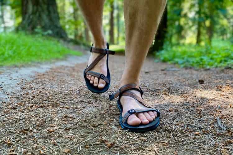 Close up of a hiker walking up the trail in a pair of sandals