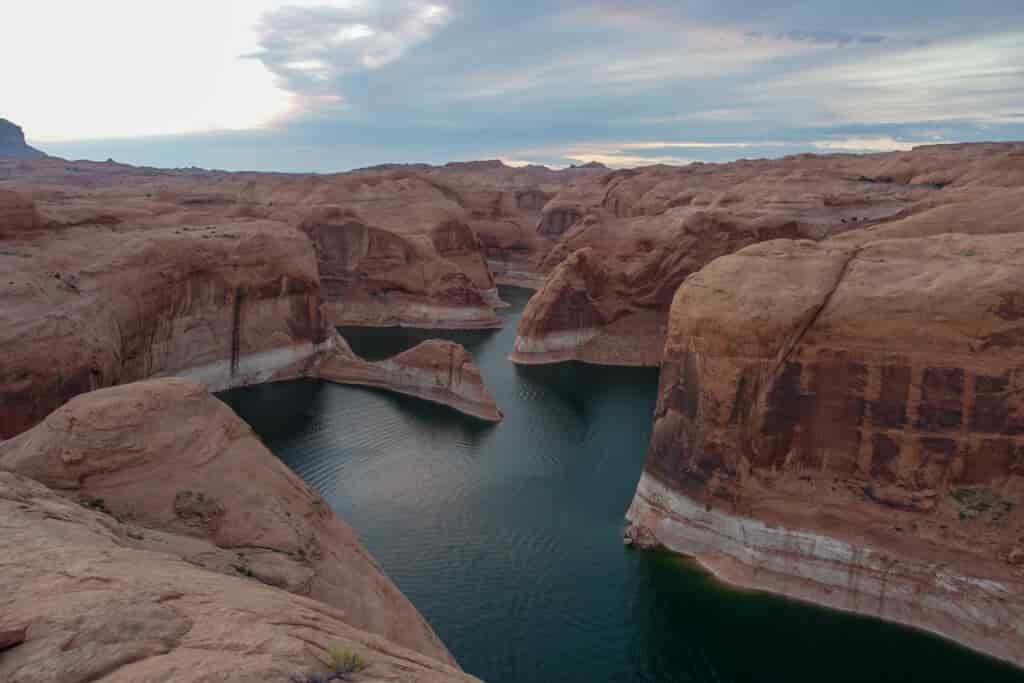 a view of the canyon with clouds and moody water settling in the bottom