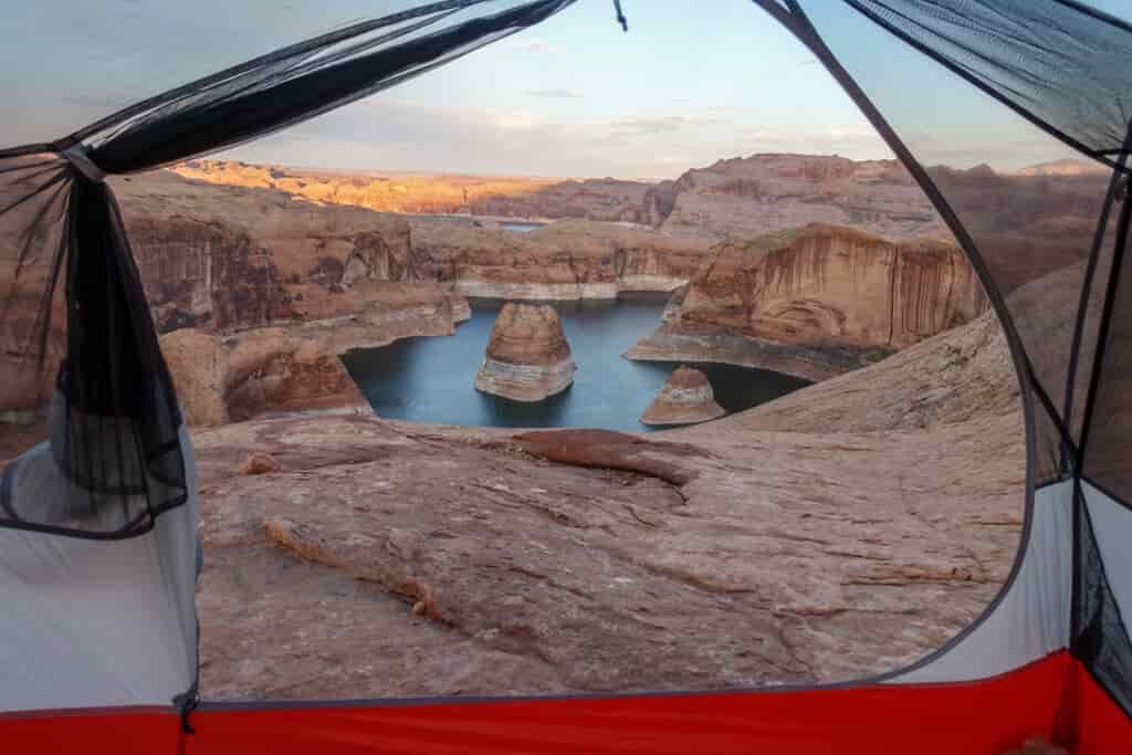 set among a tent frame is Reflection Canyon with varying shade and sunlight sections
