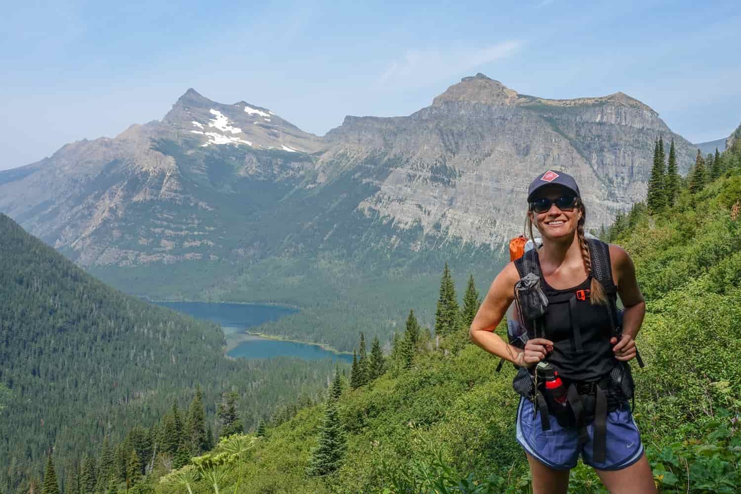backpacker on a trail in glacier national park
