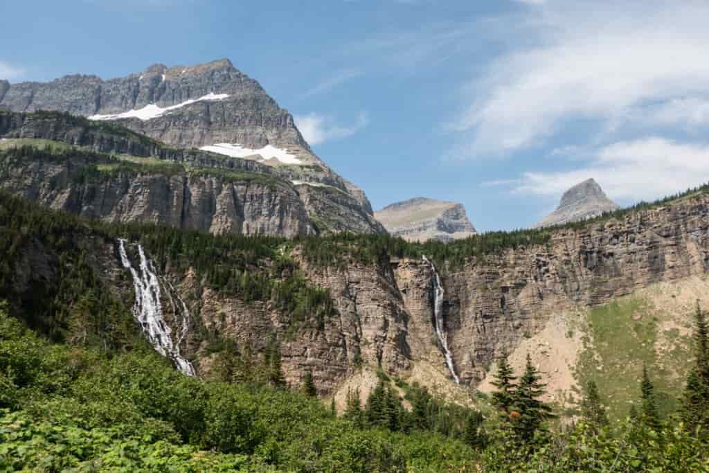waterfalls along a cliff in glacier national park
