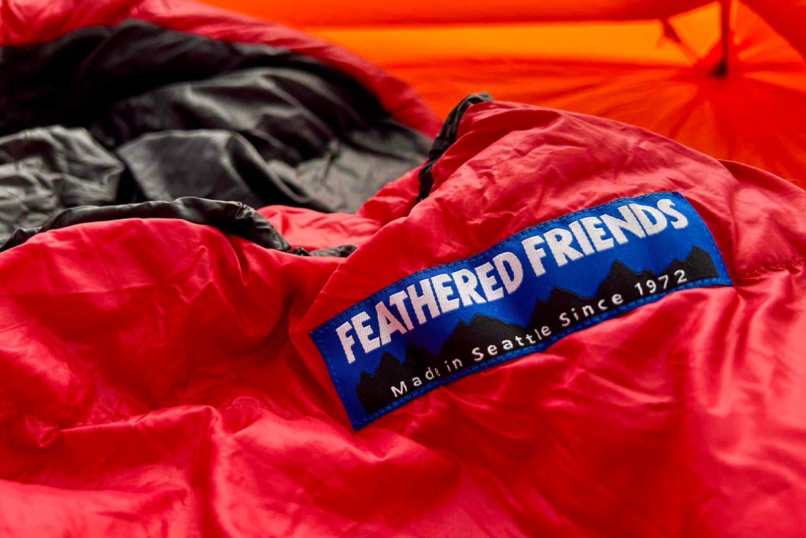 A close up image of the Feathered Friends logo sewn on a sleeping bag.