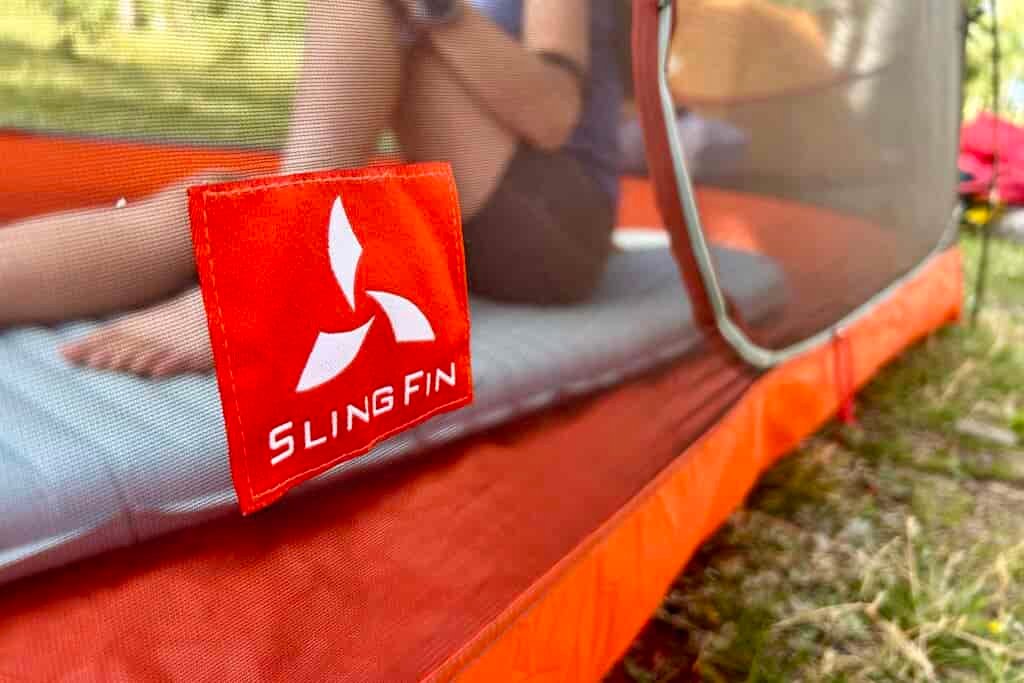 A close up of a tent's doors and zippers.