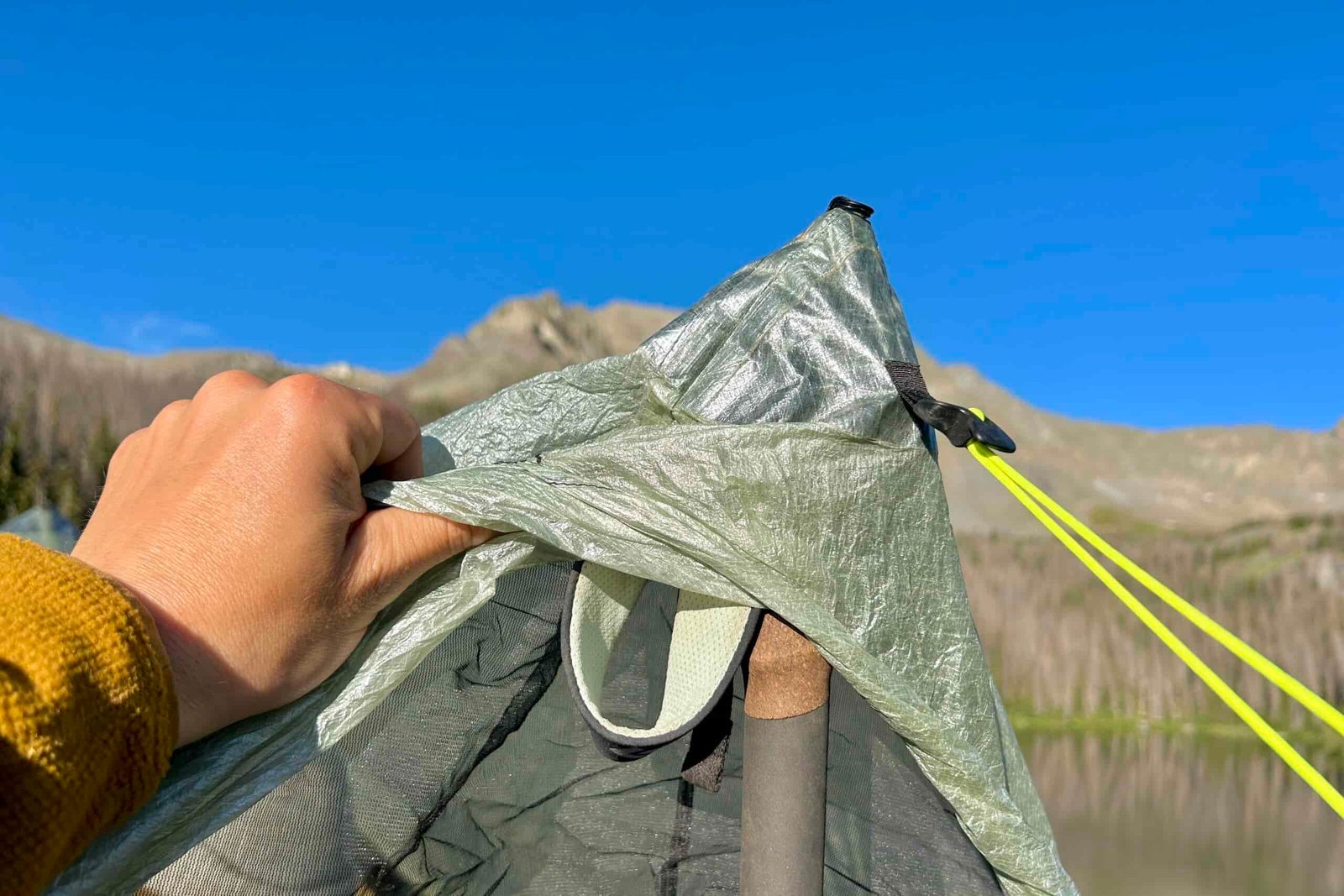 a closeup of the section of the zpacks duplex classic tent where a trekking pole is used to pitch and lift the tent space.