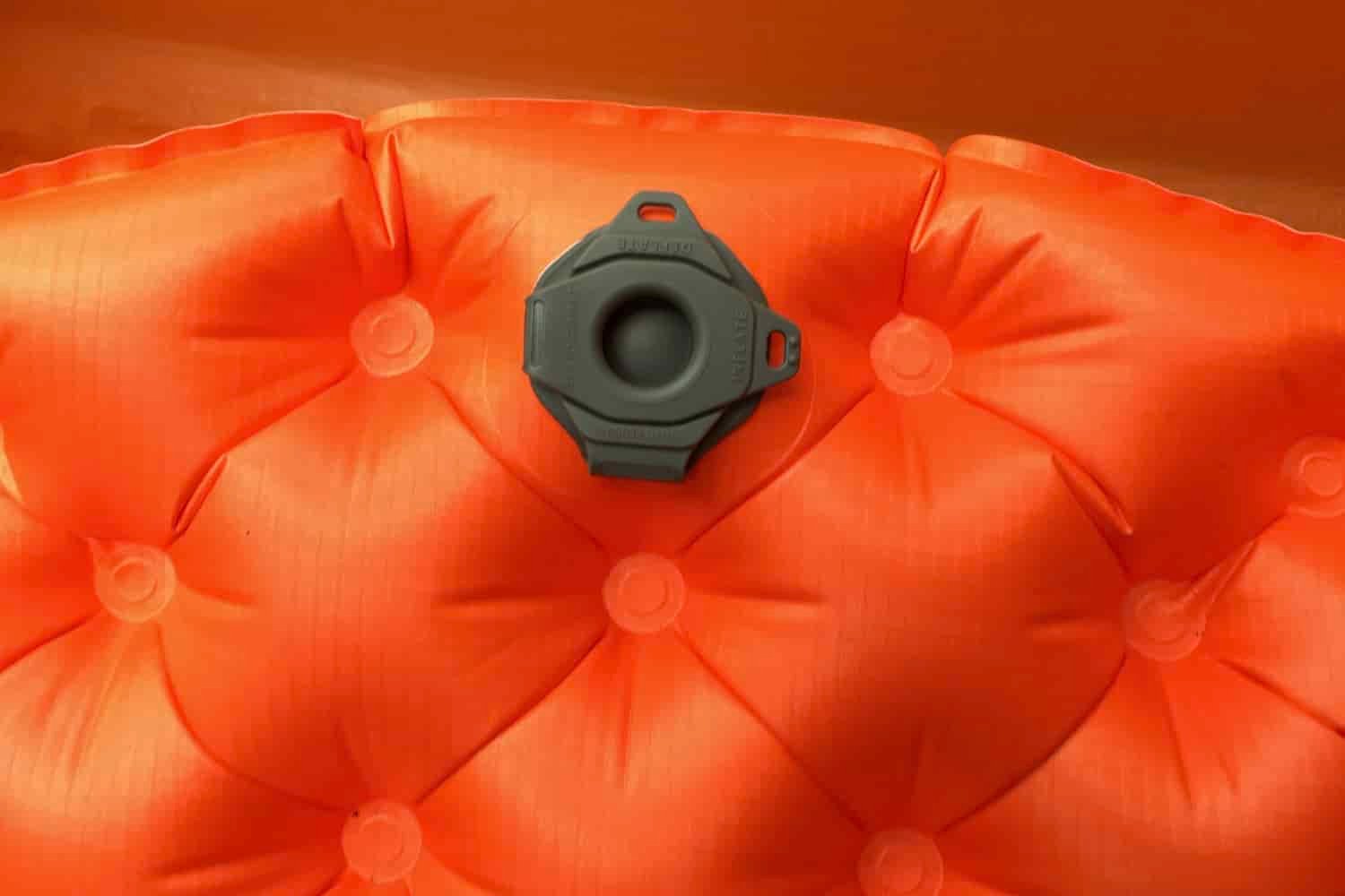 a closeup of the single valve system on the sea to summit ultralight insulated sleeping pad closed so no air can escape