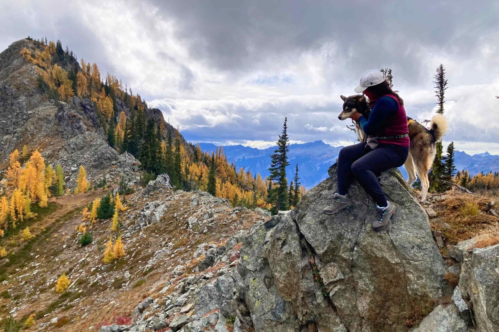 Hiker sitting near the summit of Carne Mountain in WA wearing her Merrell Moab 3 WP Women's Hiking Boots