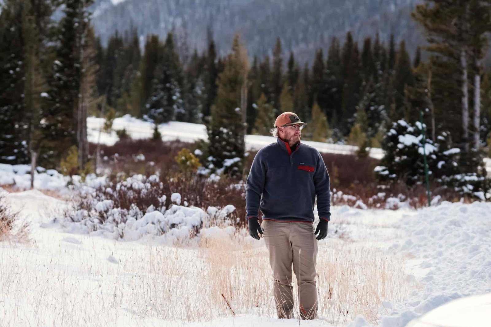 Man standing in a snowy field.