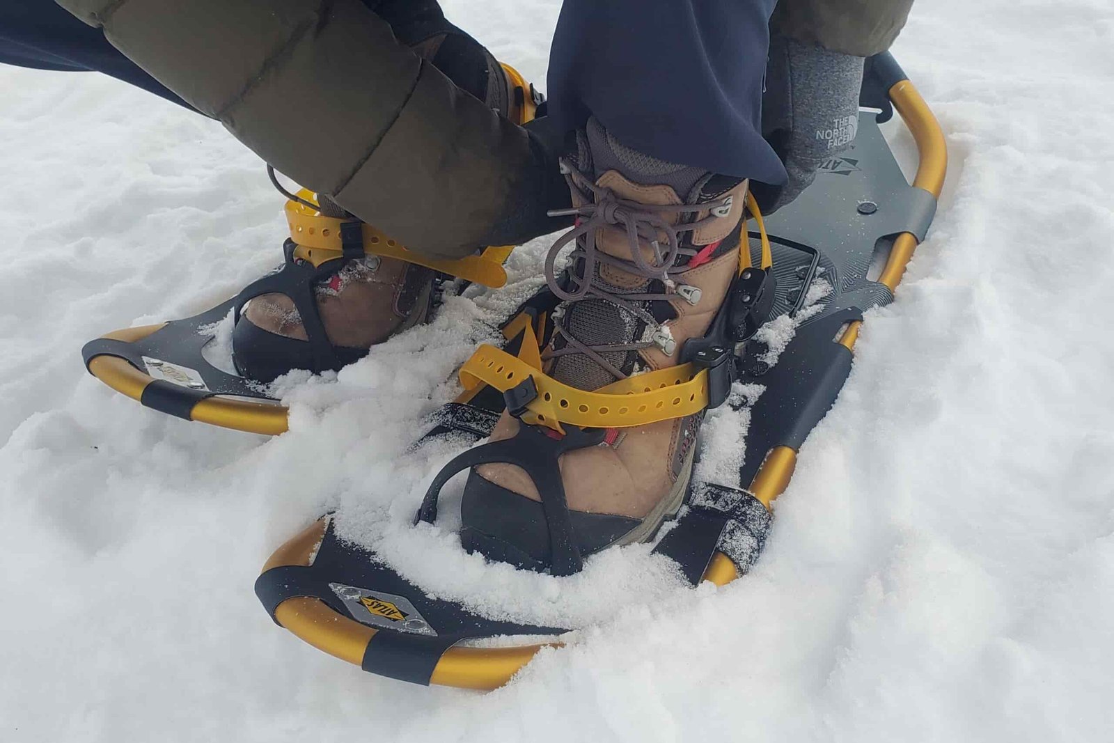 A closeup of the long straps of snowshoes.