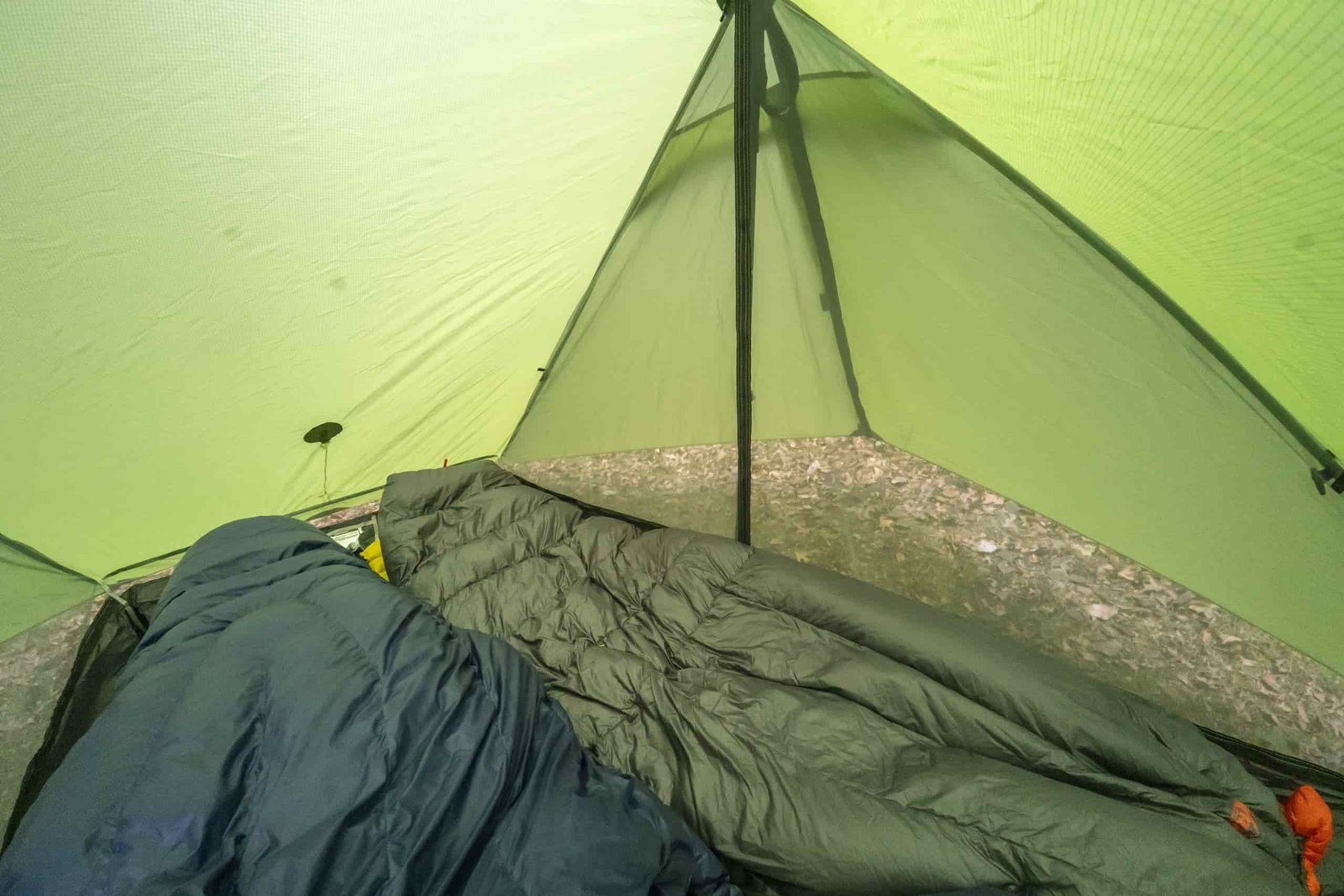 the interior of a green a frame tent