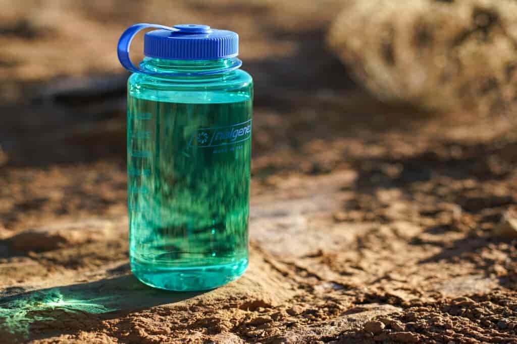The Nalgene Wide Mouth sits on the ground.
