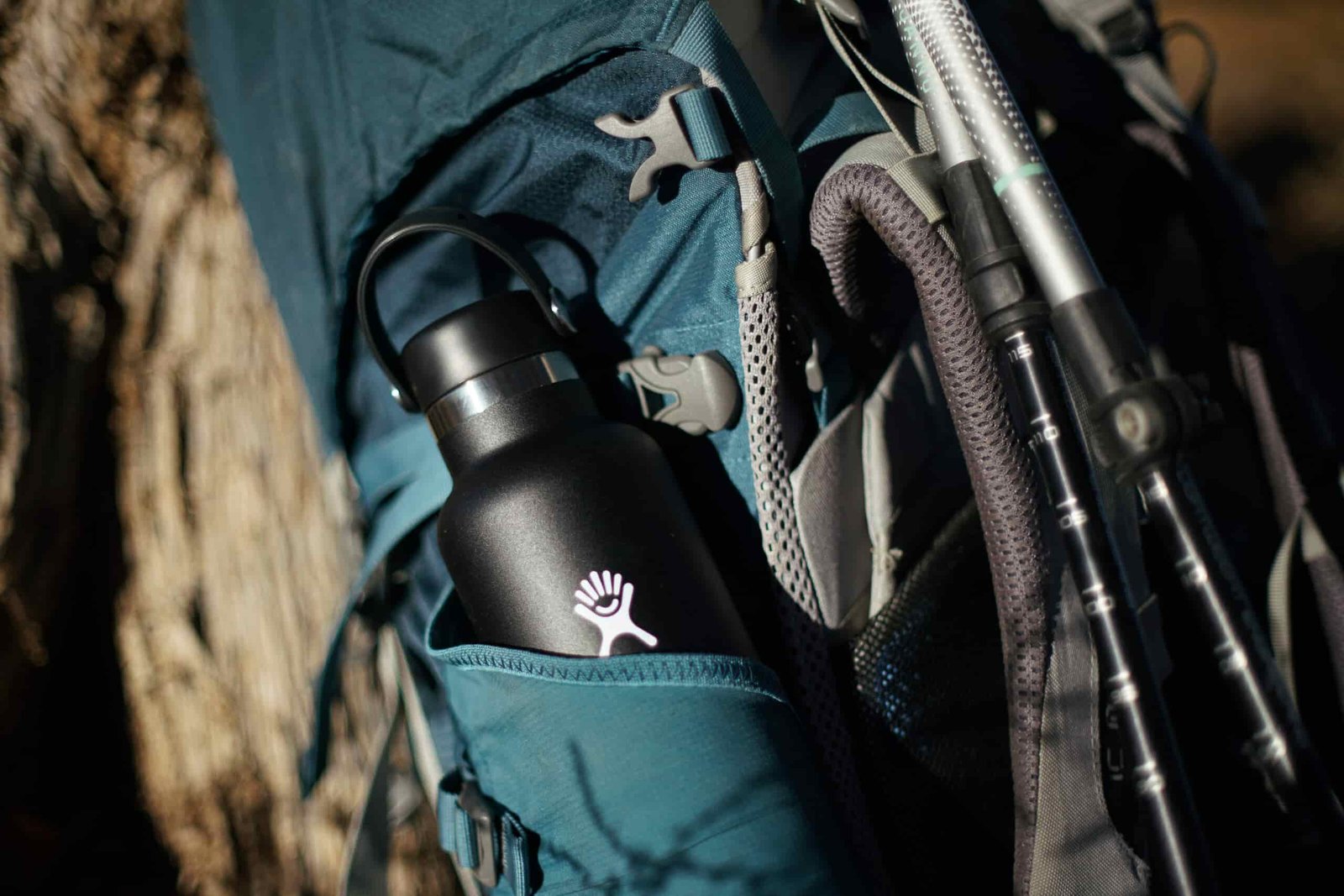 A close up of the Hydro Flask Standard Mouth peeking out of the pocket of a backpack.