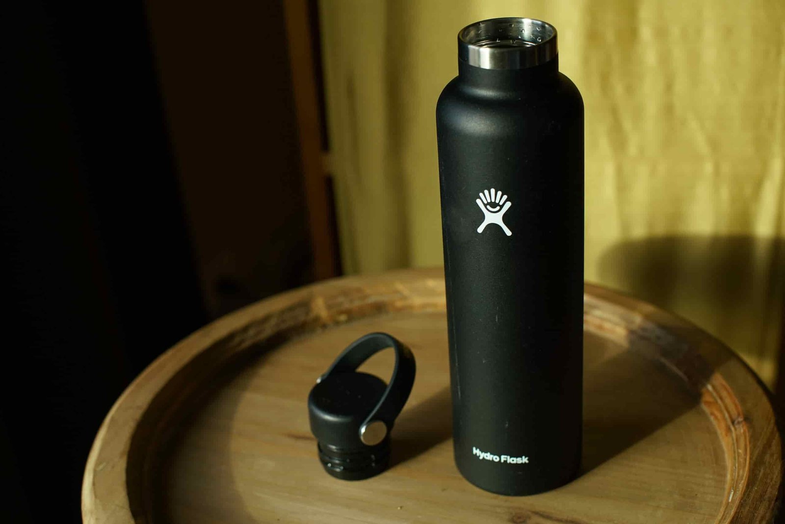 The Hydro Flask Standard Mouth sits on a table with its lid beside it.