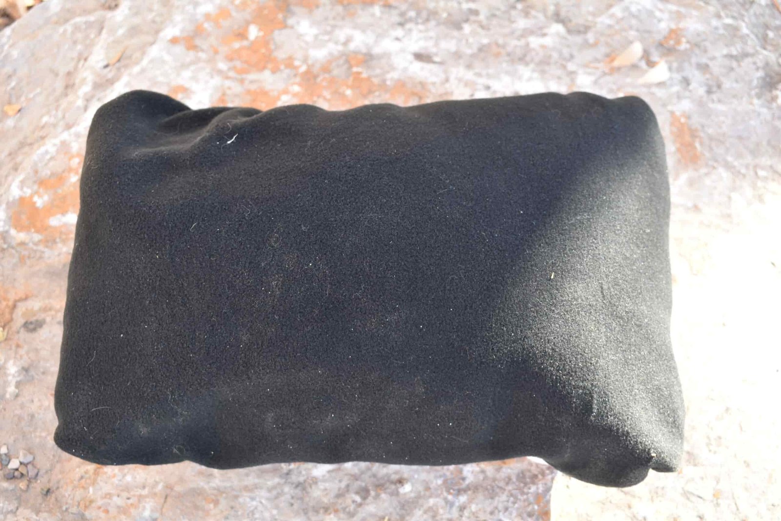 The Hyperlite Stuff Sack pillow turned inside out to show its fleece lining