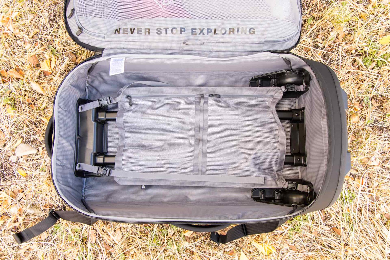 Inside the bag: the compression panel with two zipper pockets is clipped in place.