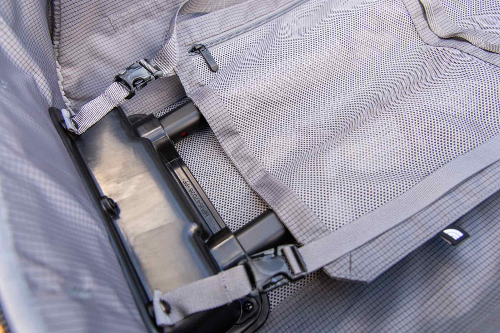 A close-up of the clips that fasten the compression panel in place.