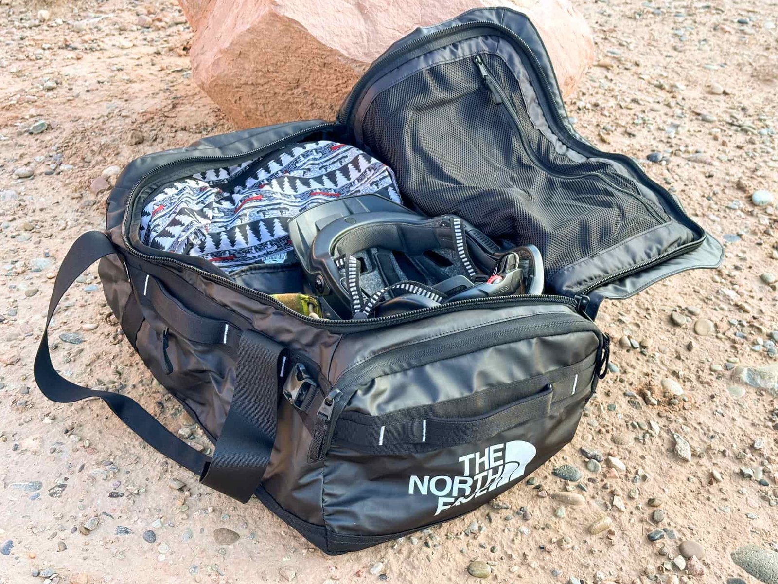 The North Face Base Camp Voyager opened up and full of bike gear.