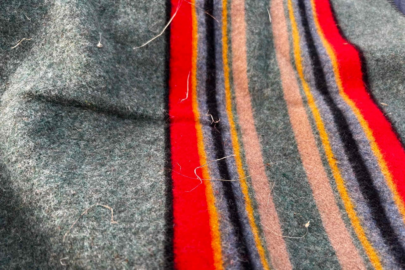 Close-up of the Pendleton Yakima Camp Blanket, showing the debris cling to the fabric.