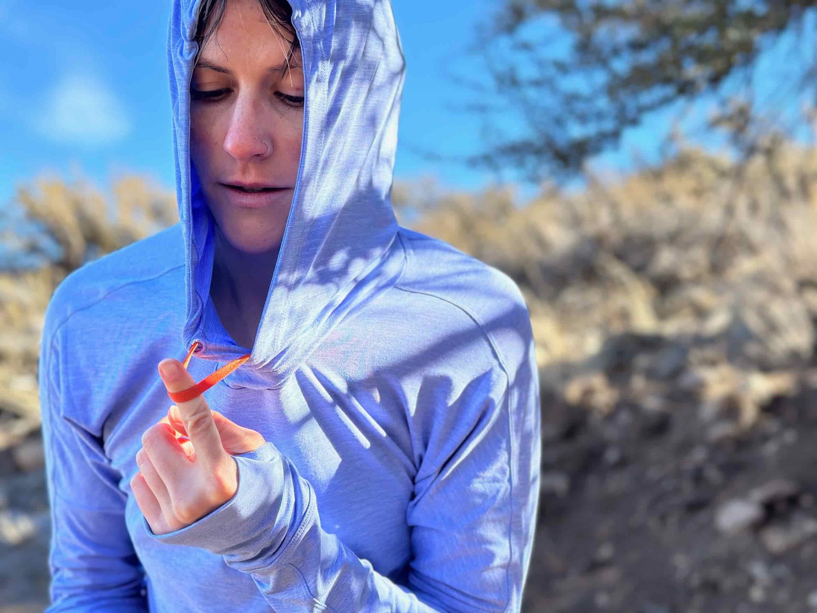 woman hiking in high desert with dog