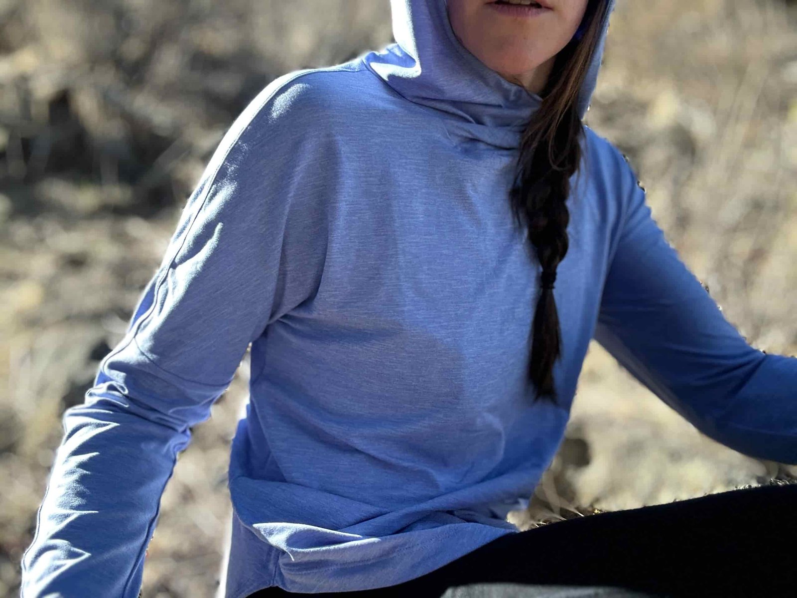 woman hiking in high desert with dog