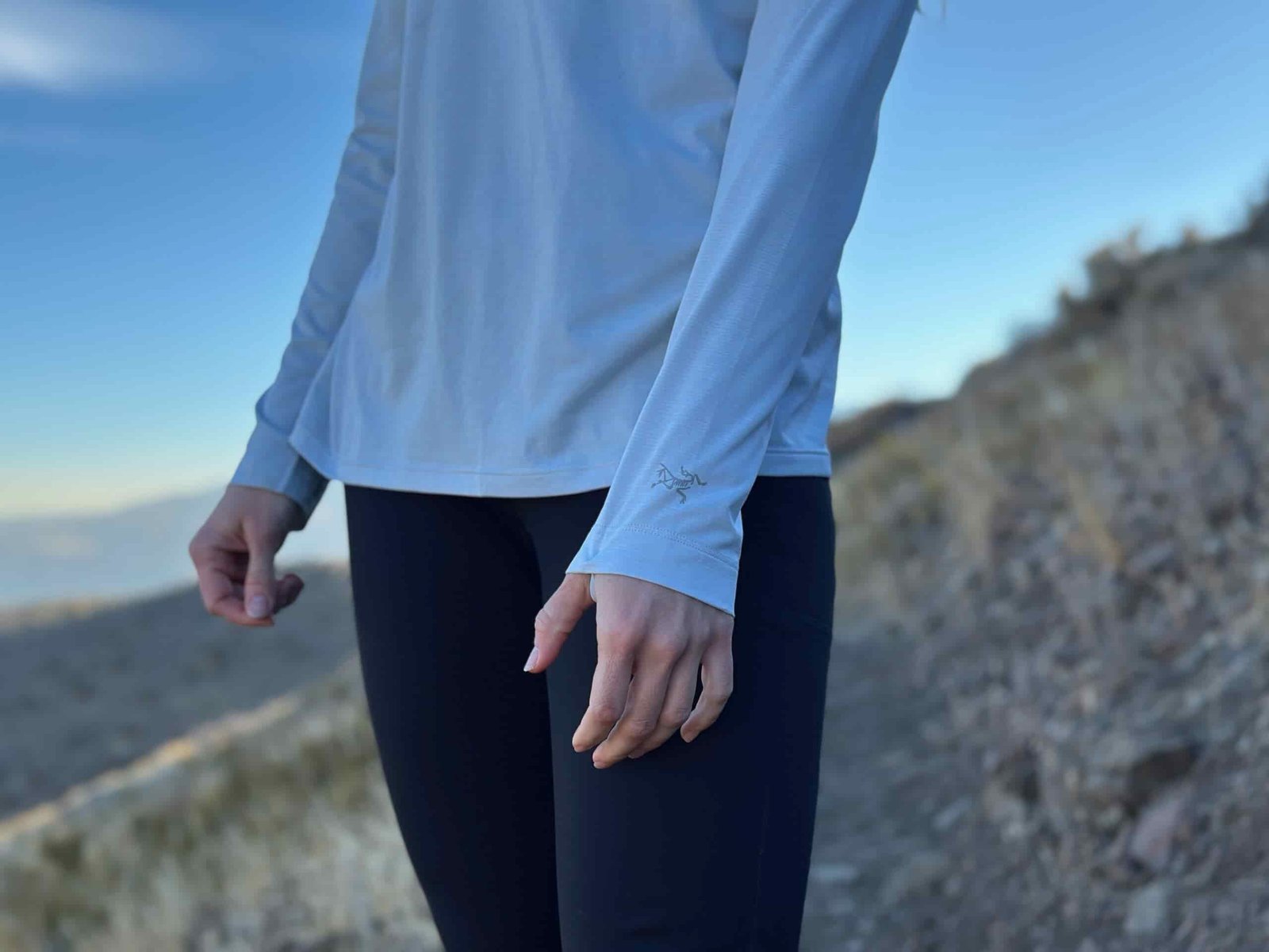 woman hiking and running through high desert