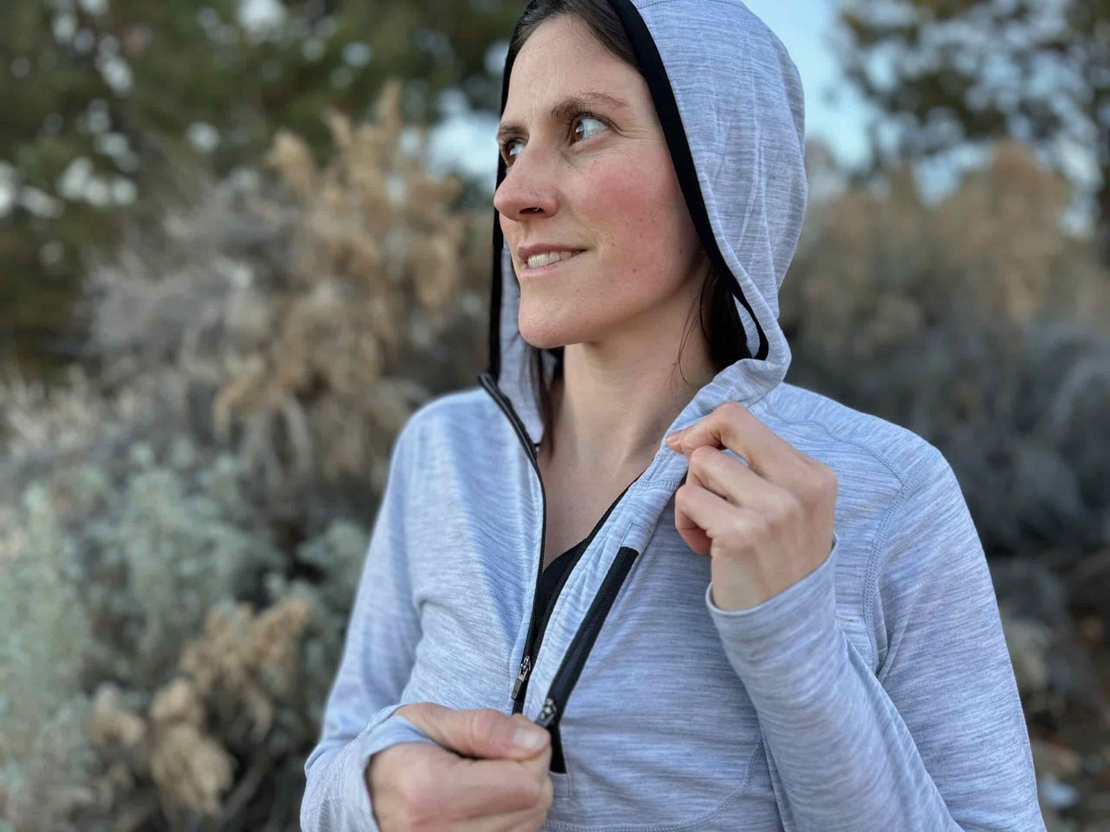 woman hiking around high desert plants