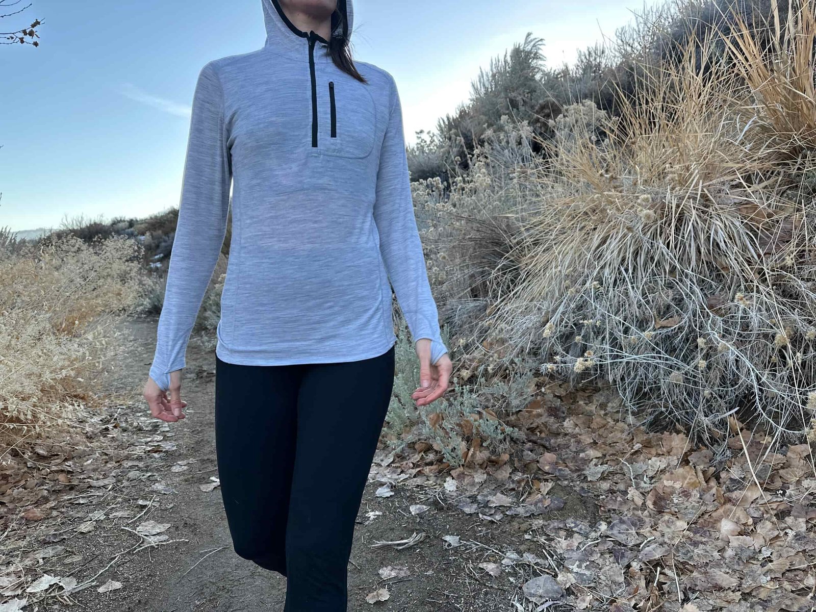 woman hiking around high desert plants