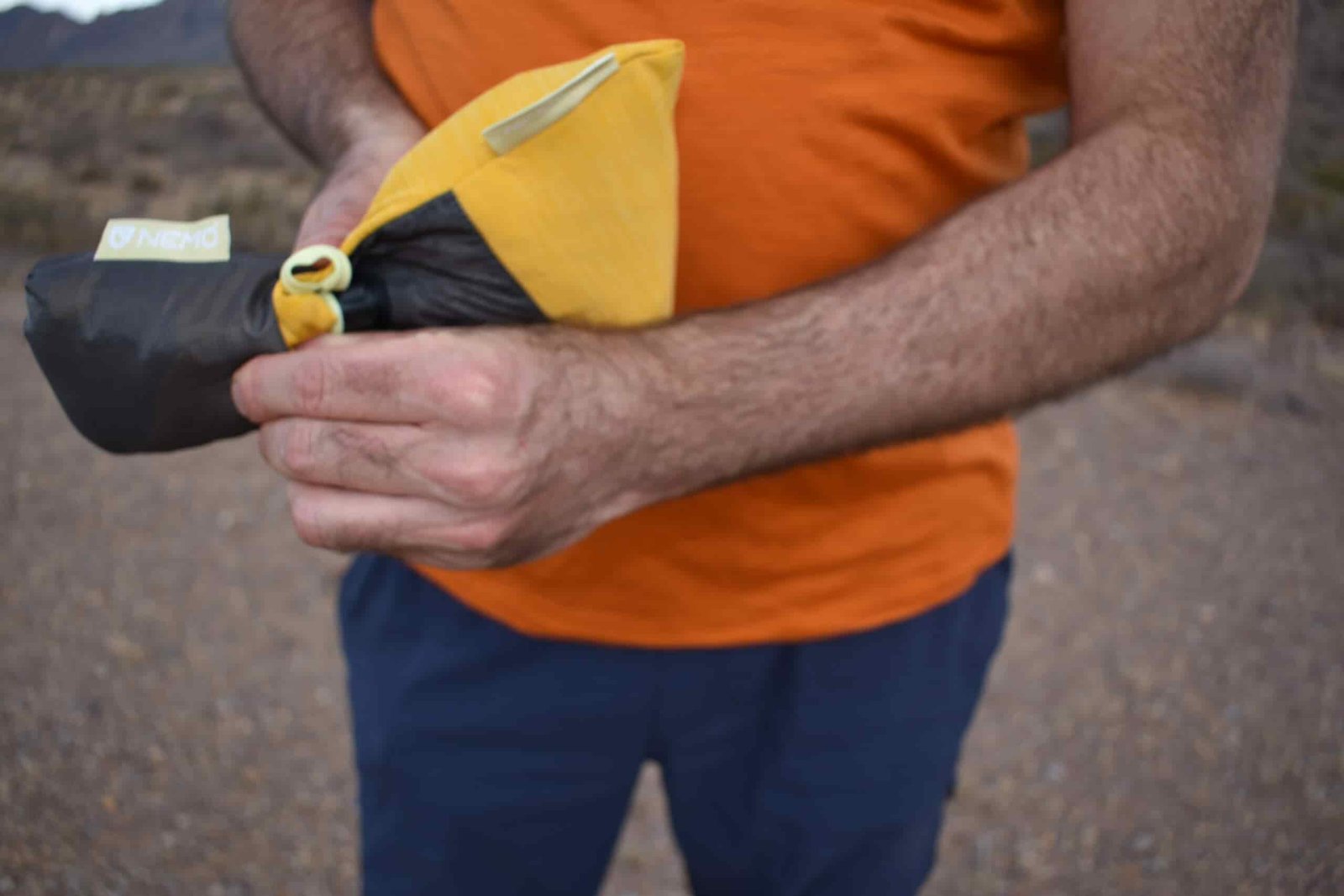 The author smashing the Elite Luxury Pillow into a small stuff sack