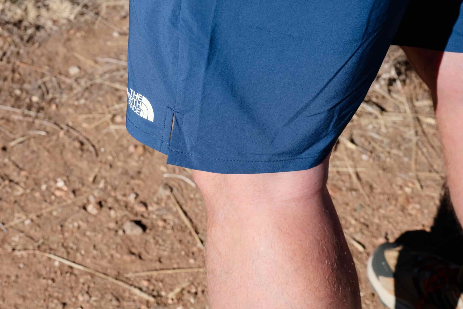 The hem of North Face shorts up close.