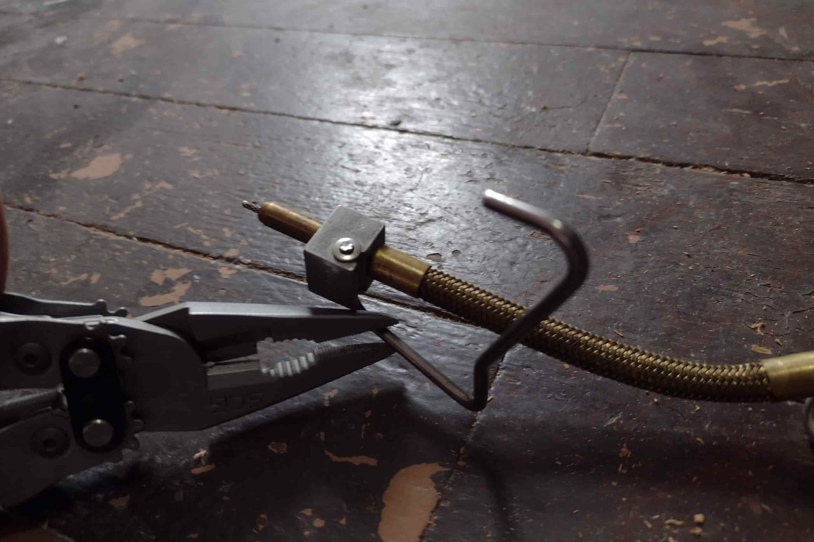 The SOG PowerAccess Deluxe with its pliers repairing a camp stove.