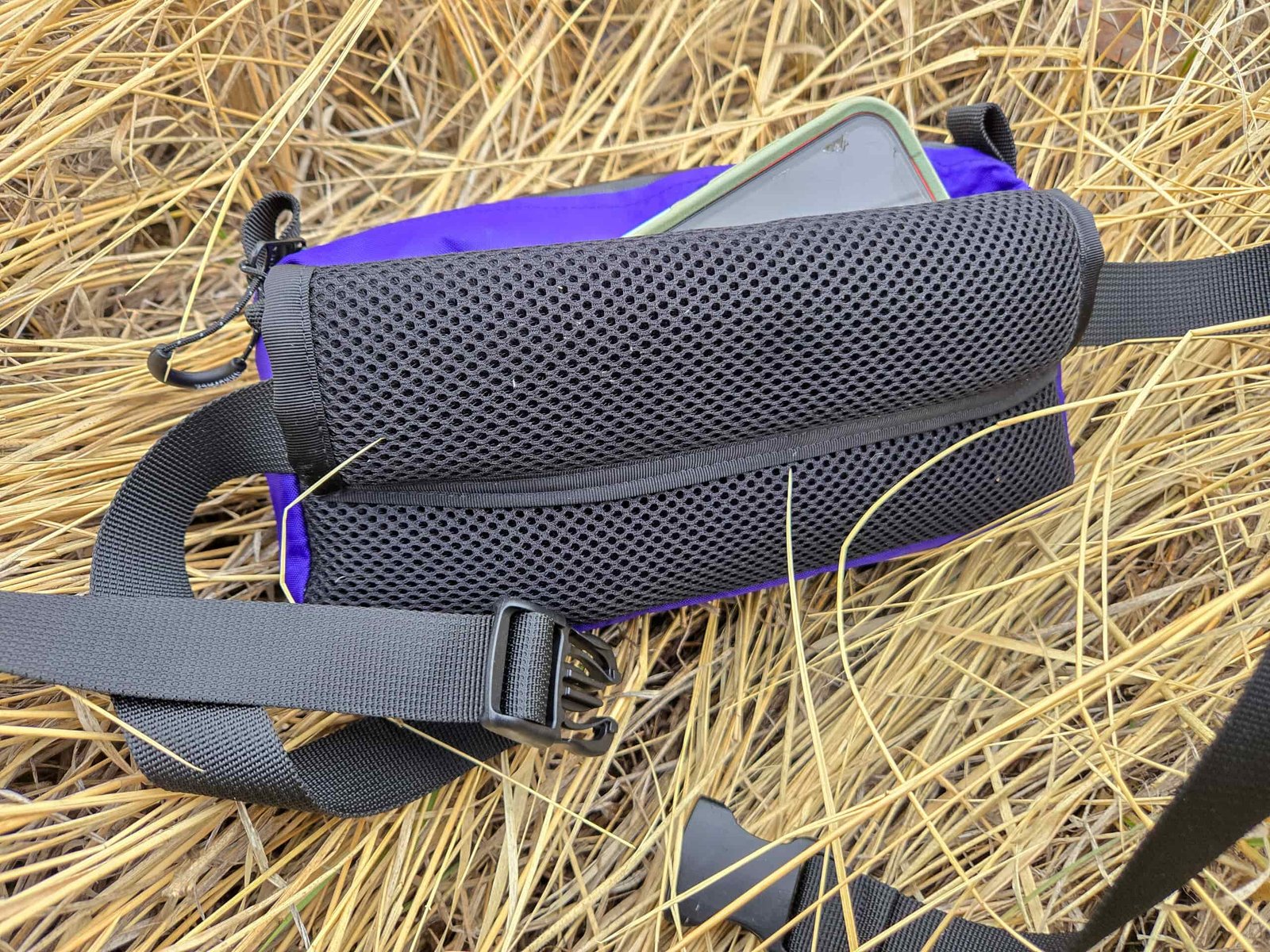 view of the padded back and pocket on the thrupacks summit bum fanny pack