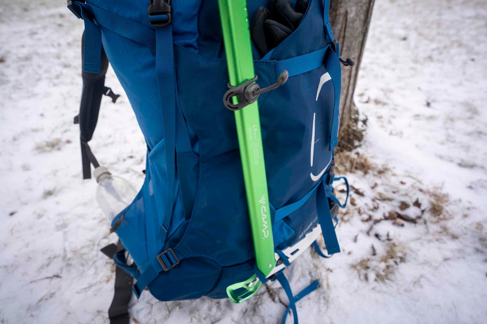 ice axe attached to backpack