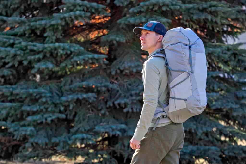 a man wearing a white backpack