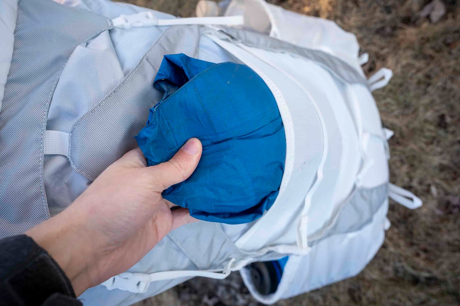 a rain jacket in a backpack pocket