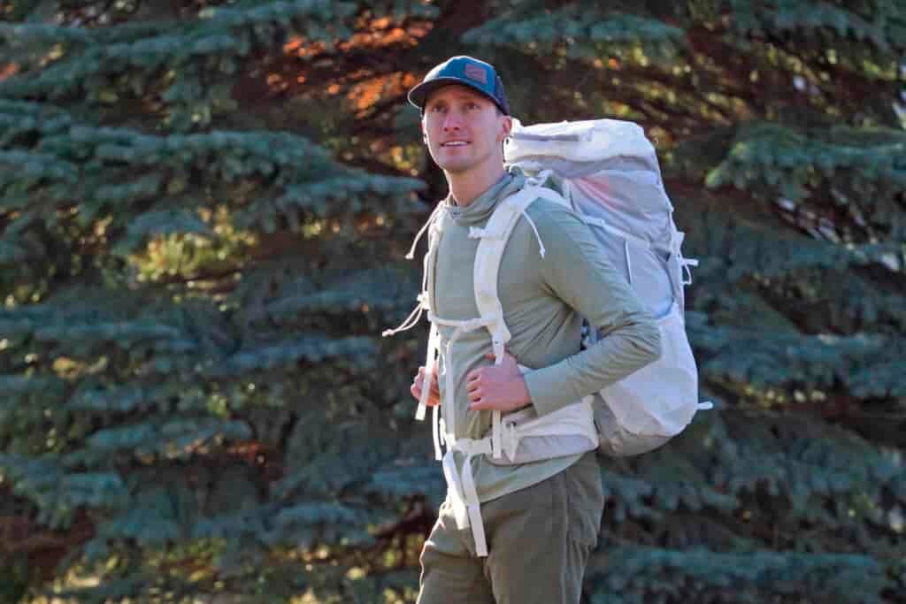 a man wearing a white backpack