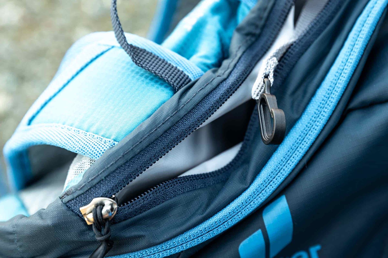 Details of Deuter Speed Lite 13 Hydration Pack - top pouch with a key chain hook
