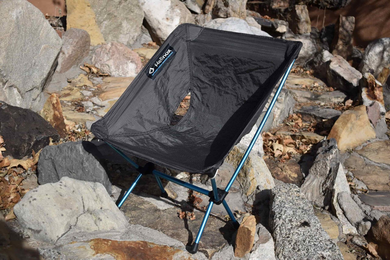 Helinox Ground Chair sits on a bed of rocks